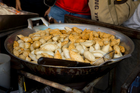 Fried fish starters at a street food stall in the city of Bangkok in Thailand..の写真素材