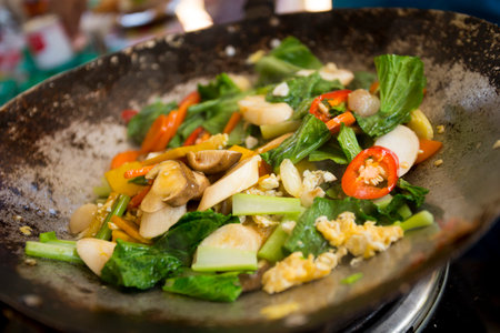 Vegetable wok at a street food stall on the streets of Bangkok, Thailand.