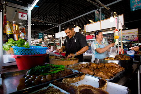 Krabi, Thailand; 1st January 2023: Sellers and buyers at the Krabi fresh fish market.のeditorial素材