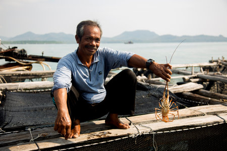 Koh Yao, Thailand; 1st January 2023: Local fisherman at a lobster farm on an island in southern Thailand.のeditorial素材
