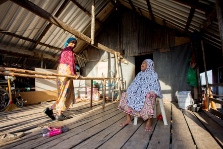 Koh Yao, Thailand; 1st January 2023: Elderly people in a fishing village on the island of Koh Yao in southern Thailand.のeditorial素材