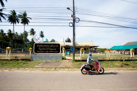 Koh Yao, Thailand; 1st January 2023: People on Koh Yao island driving mopeds on a road.のeditorial素材