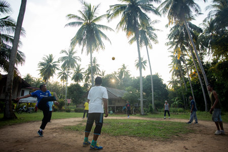 Koh Yao, Thailand; 1st January 2023: Young man playing ball in a palm field on Ko Yao island.のeditorial素材