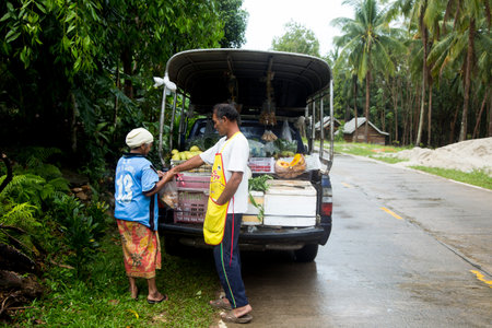 Koh Yao, Thailand; 1st January 2023: Street vendor with his truck full of products in his trunk.のeditorial素材