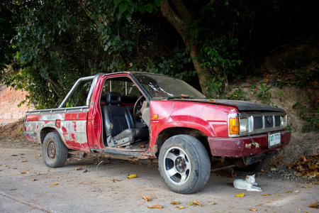 Koh Yao, Thailand; 1st January 2023: Old abandoned car without a red door.のeditorial素材