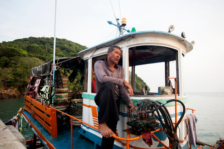 Koh Yao, Thailand; 1st January 2023: Thai fisherman in his boat in the Andaman Sea.のeditorial素材
