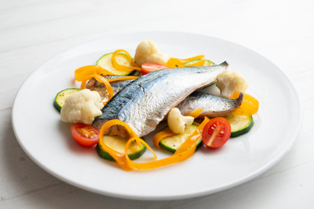 Steamed mackerel with cauliflower and other seasonal vegetables.の写真素材