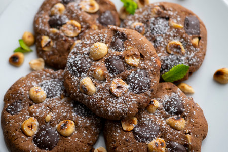 Homemade chocolate cookies with hazelnut pieces.の写真素材