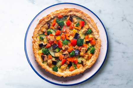 Veggie quiche traditional french recipe on puff pastry.の写真素材
