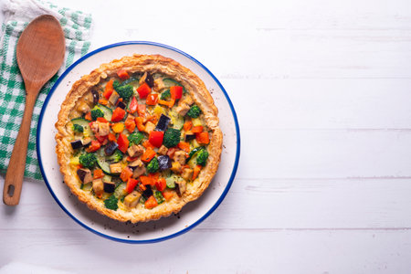 Veggie quiche traditional french recipe on puff pastry.の写真素材