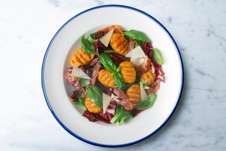 Gnocchi salad with bacon and Italian cheese.の写真素材