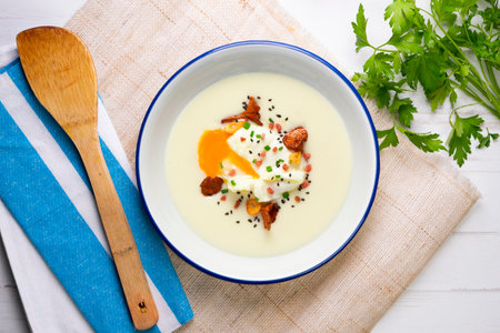 Poached egg with potato cream and mushroomsの写真素材