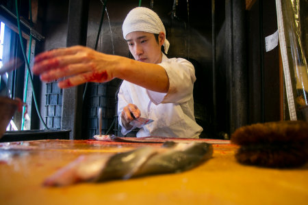 Narita, Japan; 1st October 2023: Japanese chef preparing and cleaning an eel. Grilled smoked eel is the most traditional food in Narita.のeditorial素材