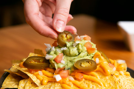 Nachos with guacamole and vegetables. Original Mexican recipe.の写真素材