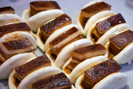 Chinese bao stuffed with roasted pork belly cooked in the Chinese district of Nankinmachi in the...