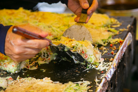 Okonomiyaki is a savory Japanese cabbage pancake â€œgrilled as you like itâ€ with your...