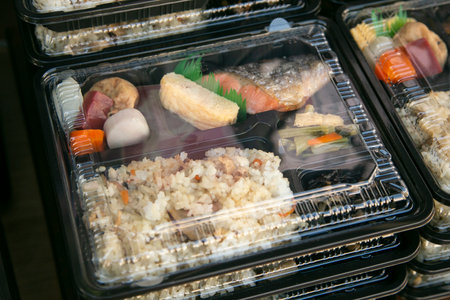 Bento is a ready-to-go portion of food, quite common in Japanese cuisine. Traditionally it usually includes rice, fish or meat, and a vegetable-based garnish or accompaniment.の写真素材