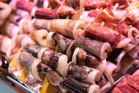 Fresh Japanese calamari at a market stall in Nishiki fish market in Kyoto, Japan.の写真素材