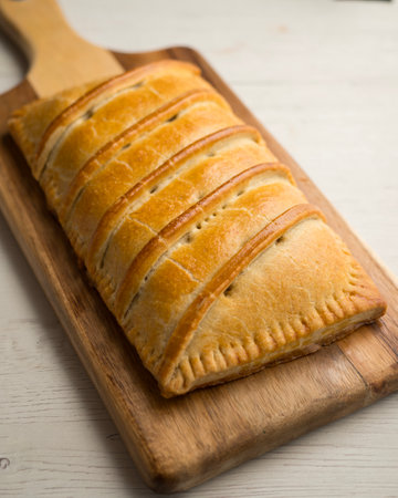 Traditional Galician empanada filled with vegetables and anchovies. Traditional recipe from the northern part of Spain.の写真素材