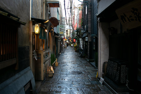 Osaka, Japan; 20th October 2023: Narrow streets in Dotonbori full of businesses and restaurants.のeditorial素材