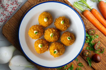 Spanish Tapa croquettes made with bechamel sauce and stuffed fish and mayonnaise. Top view table.