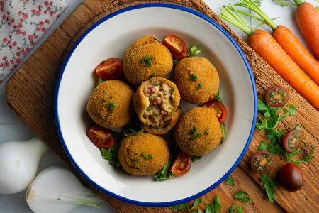 Spanish Tapa croquettes made with bechamel sauce and stuffed with octopus and potato. Top view...