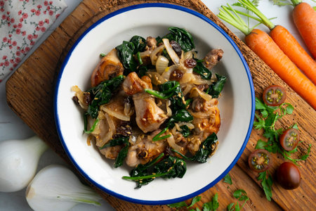 Delicious Rabbit stewed with spinach and raisins. Top view tableの写真素材