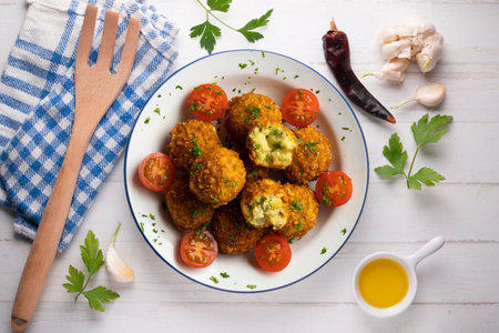 Vegan Chickpea balls coated with panko. Top view table.