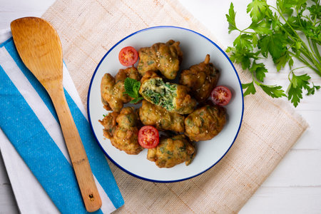Spinach fritters. Top view table.の写真素材