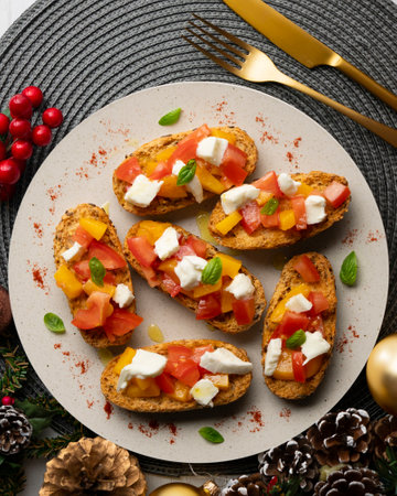 Delicious Italian bruschetta with mozzarella and peach. Top view table.の写真素材
