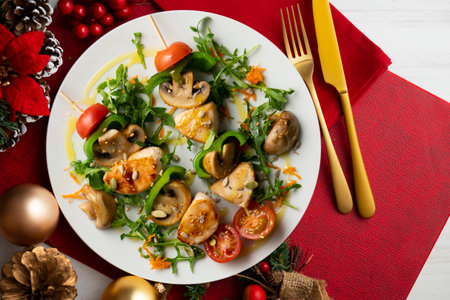 Turkey skewers with mushrooms and vegetables. Top view table with christmas decoration.の写真素材