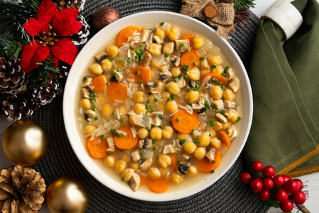 Chickpea and rice soup with mushrooms and vegetables. Top view table with decorations.の写真素材