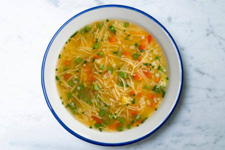 Vegetable soup with green beans and red pepper. Top view table with decoration.の写真素材