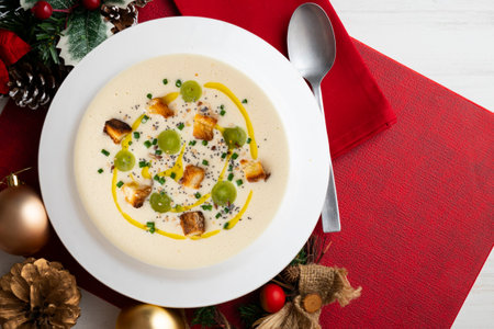 Spanish tapa cold soup of ajoblanco with grapes. Top view table with Christmas decoration.の写真素材
