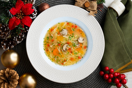 Short noodle soup with vegetables and mushrooms. Top view table.の写真素材