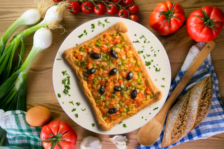 Coca de trampo mallorca with vegetables. Top view table with decorations.の写真素材