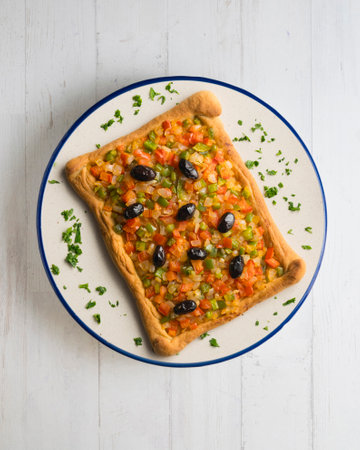Coca de trampo mallorca with vegetables. Top view table with decorations.の写真素材