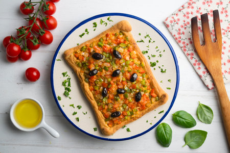 Coca de trampo mallorca with vegetables. Top view table with decorations.の写真素材
