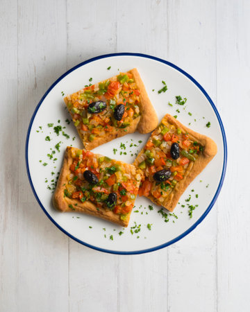 Coca de trampo mallorca with vegetables. Top view table with decorations.の写真素材