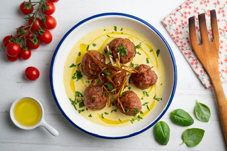Fried meatballs with curry sauce. Top view table with decoration.の写真素材