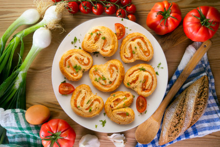 Puff pastry filled with salmon and cheese. Top view table with decoration.の写真素材