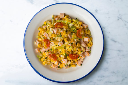 Healthy white cabbage, corn and turkey salad. Top view table with decorations.の写真素材