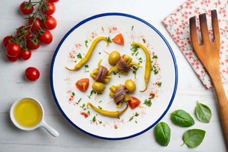 Gilda. Basque tapas pincho with chilli, anchovy and olive. Top view table with decorations.の写真素材