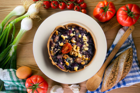 Individual vegan quiche with vegetables and red cabbage. Top view table with decoration.の写真素材