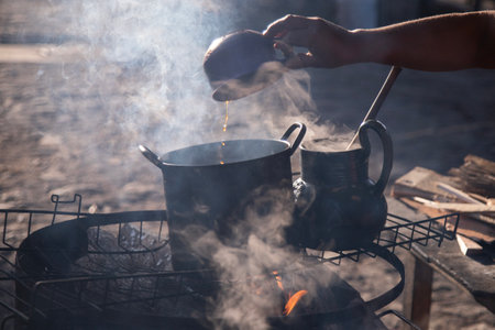 Clay and iron pots at a street food stand in Oaxaca cooking traditional Mexican cafe de roca.の写真素材