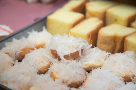 Traditional sweets stand with empanadas, cocadas, mamones in the Oaxaca food market.