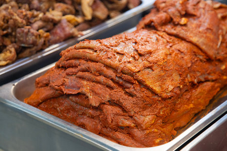 Cecina from Oaxaca. Mexican sliced cured pork or beef meat from Oaxaca displayed in a butcher shop...