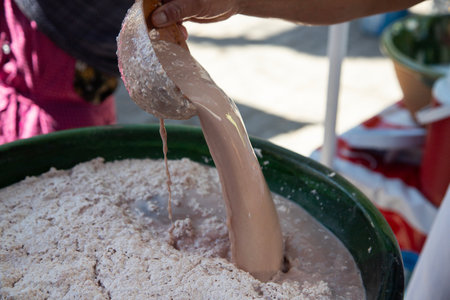 Pozol is a traditional Mexican drink made from corn dough that regularly includes cocoa and can be fermented.の写真素材