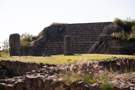 Adoration at the ancient archaeological ruins of Monte Alban in the Oaxaca region of Mexico. Ancient capital of the Zapotecs and one of the first cities in Mesoamerica.の写真素材