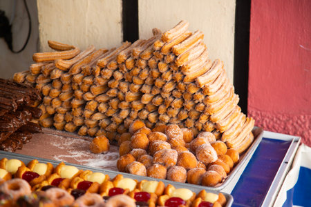 Market stall in Oaxaca with traditional sweets such as churros, donuts and meringues.